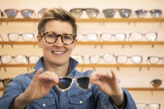 An image of a woman in a eyewear store