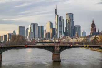 A big city in the evening at sunset. Modern buildings in a skyline by the river. Skyscrapers are