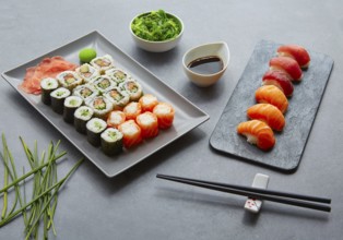 Sushi Maki and Niguiri California roll with seaweed chuka salad soy sauce and wasabi