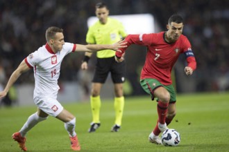 Football match, captain Cristiano RONALDO CR7 Portugal on the ball right in a duel with Dominik