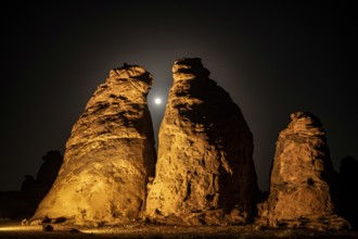 Full moon behind the columnar rocks of Gharameel, Hail region, Al Ula, Saudi Arabia, Asia