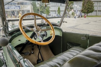Lisbon, Portugal - Oct 15, 2023: Green interior with steering wheel and car dashboard of vintage