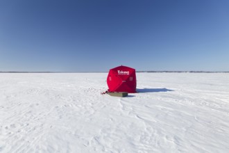 Winter, icefishing tent on the frozen Saint Lawrence River, Province of Quebec, Canada, North