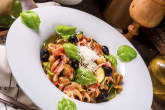 Ribbon Pasta with courgette and olives in tomato sauce