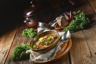 Rustic kale soup with meat and sausage