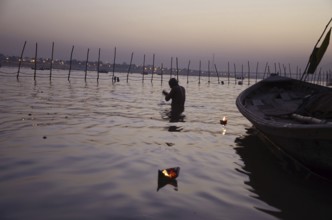 Man bathing in river Kumbh Mela at Allahabad Uttar Pradesh India