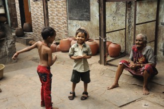 Child playing dharavi slum, mumbai, maharashtra, India, Asia