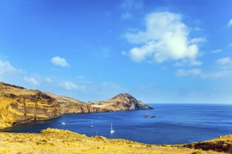 The west coast of the island of Madeira - the bay between the rocks with yachts and boats. Madeira