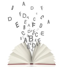 Open book with flying letters lying isolated on white
