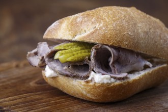 Cold roast pork in a roll