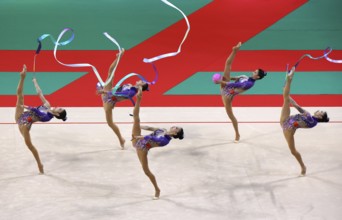 Sofia, Bulgaria - 16 September, 2022: Members of team China in action with 2 balls and 3 ribbons