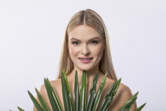 A serene, graceful woman gently cradling a lush aloe vera plant, embodying beauty, wellness, and