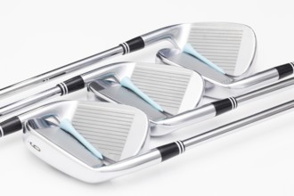Titanium golf clubs on the white background