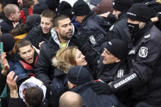 Sofia, Bulgaria - 12 January, 2022: People try to enter the Bulgarian Parliament building during a
