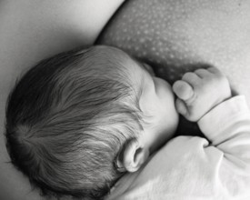 Mother breast feeding her baby