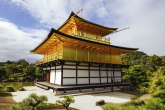 The world famous Kinkakuji Temple (The Golden Pavilion) in Kyoto, Japan on a warm autumn morning