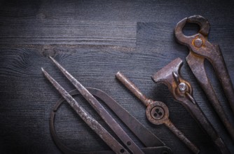 Set of vintage tools on wood board