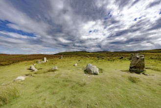 Druids Circle, stone circle in wide landscape with pastures in the mountains, Penmaenmawr,