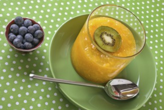 Orange and peach jelly in a glass