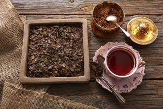 Bancha tea served pink vintage cup on wooden table board