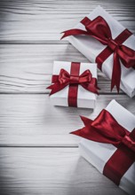 Wrapped present boxes on wooden board holidays concept