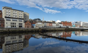 Cork, Ireland, February 24 2023: Colorful buildings reflected on river lee. Cork city cityscape