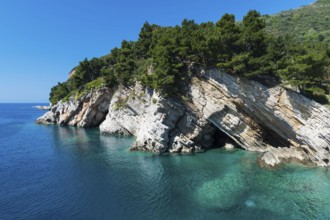 Rock structure, blue water and sky at the Adriatic coast
