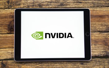 Nvidia logo on smartphone screen with AI in the background. Nvidia Corporation is an American