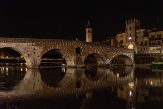 Beautiful Ponte Pietra in Verona at night, Italy, Europe