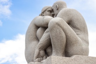 Stone sculptures against a cloudy sky. Oslo, Ostlandet. Norway