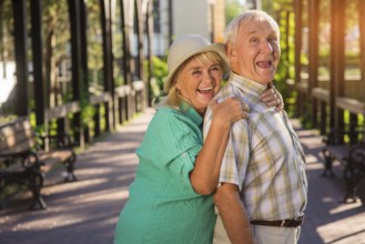 Senior woman hugging man. Elderly couple is laughing. Trust and support. Live entire life together