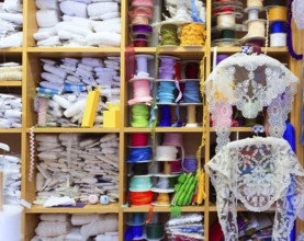 Valencia details of embroidery in old haberdashery in Plaza Redonda at Spain