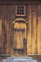 The famouse historic wooden church in Lom in Norway with blue sky summertime