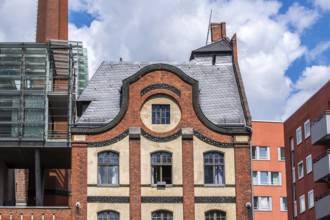 Interesting Berlin houses facade with brick and old windows. Stone house with old windows in Berlin