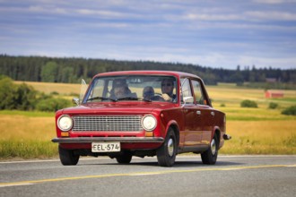 Driving red Lada 1200 on Maisemaruise 2019 car cruise. Lada 1200 was manufactured by the Russian