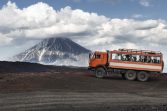 KAMCHATKA, RUSSIA, JUNE 24, 2016: Russian expedition truck KamAZ (6-wheel drive) on mountain road