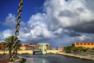 A view of a bridge in willemstad on curacao with blue sky and beautiful clouds