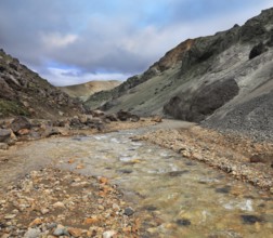 National Park Landmannalaugar in Iceland. Creek in the gorge between the mountains of black