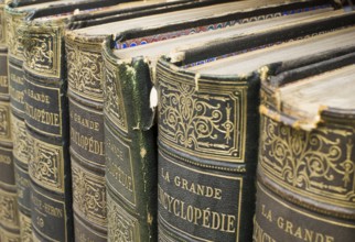 Old books on shelf. French encyclopedia. Close up shot