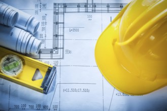 Building helmet construction level drawings on blueprint