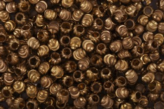 Golden beads close-up on a background