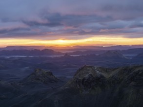 Cloudy mood and evening light at sunset, view from Mount Sveinstindur, volcanic landscape, lakes,