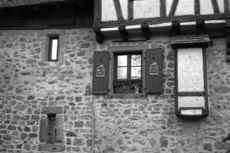 Windows and stone wall, riquewihr colmar, france