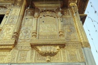 Embossed on golden temple, amritsar, punjab, india, asia