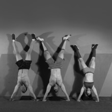 Handstand push-up group pushups workout top position at gym
