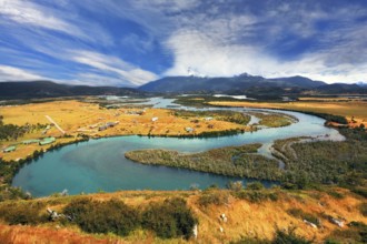 Meandering river bed of yellow autumn coast. Glen Serrano