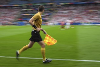 Soccer sideline referee runs during the match - intentional blurry