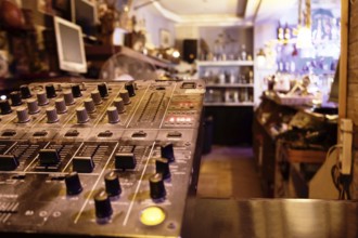 Music control center or deck in a retail store with sound, amplifier and mixing knobs for