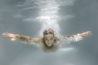 An image of a man diving in a pool