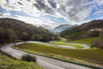 December. Central Italy. Winding mountain road serpentine after the rain. Wet asphalt. The